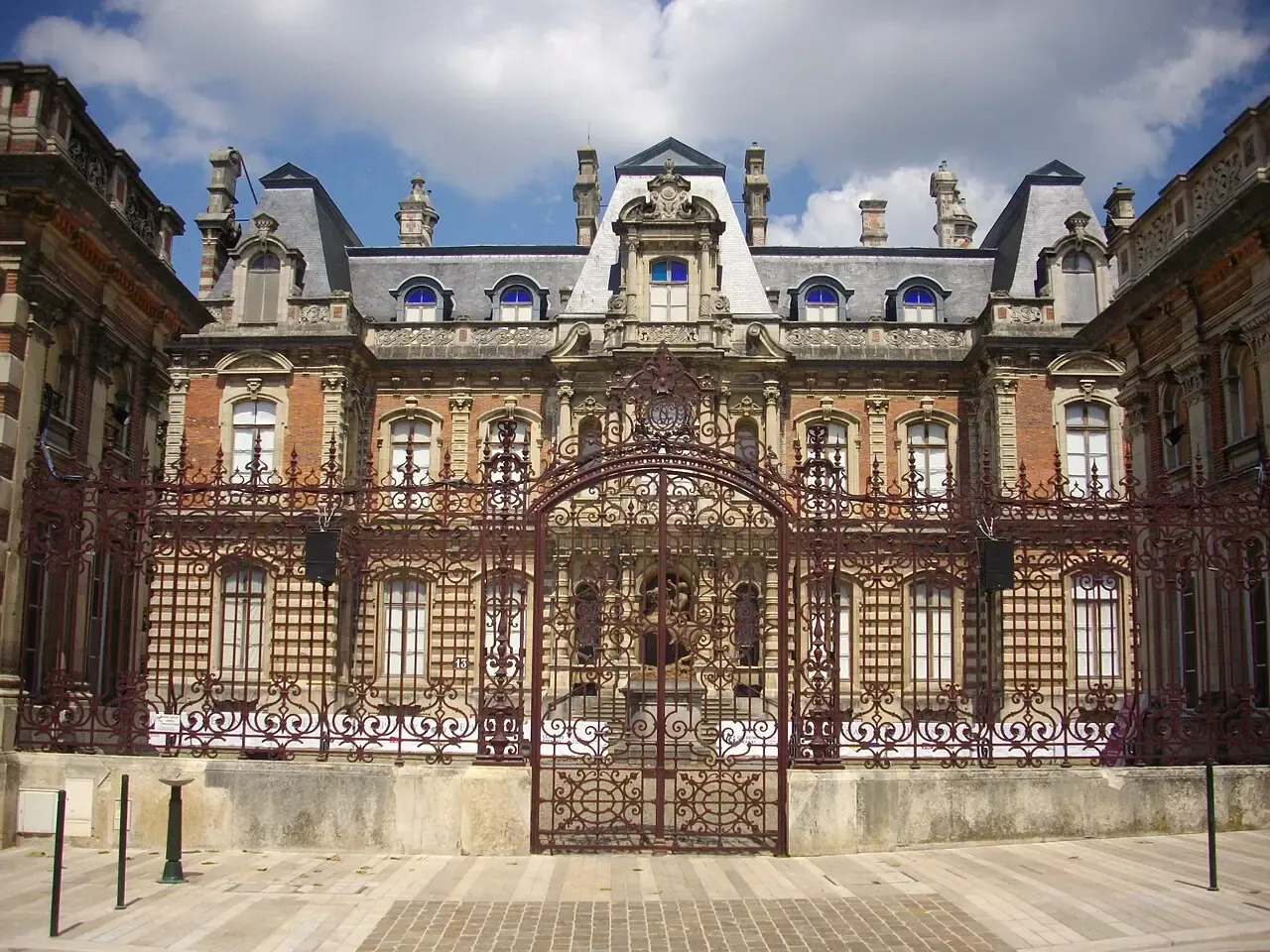 Château Perrier behind its ornate entrance gates in Épernay