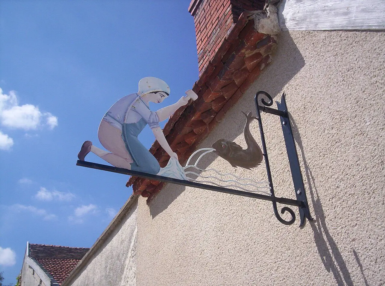 Wrought-iron sign on the washhouse in Hautvillers